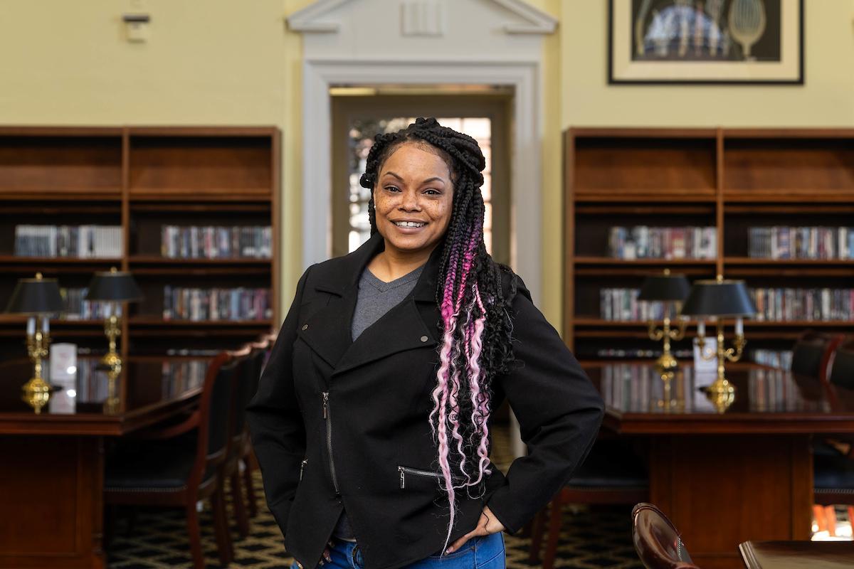 Sonia Langhorne poses in the library 